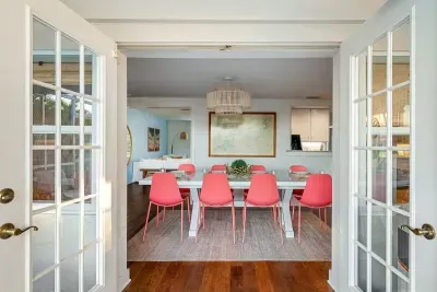 Indoor/outdoor dining option with french doors leading to outside area.
