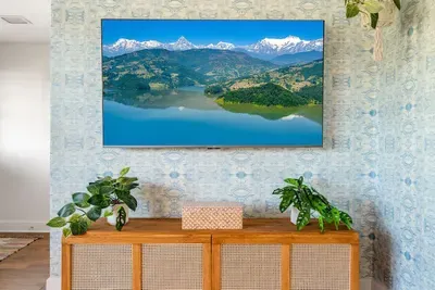 65 inch smart TV in living room.
