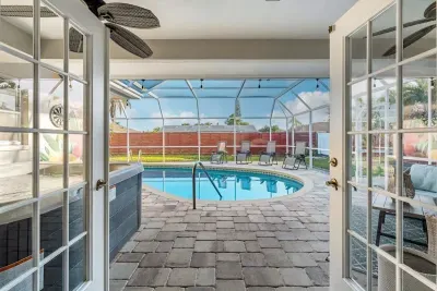 French doors leading to pool area.