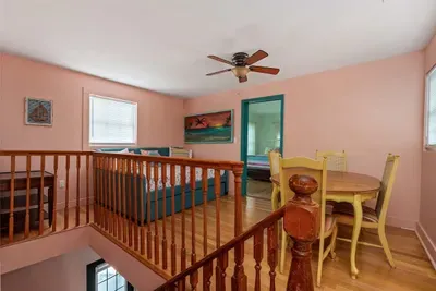 Living room with double bed and table for games