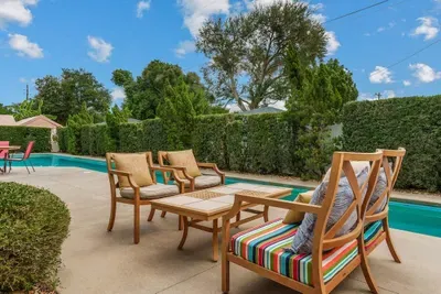 This outdoor space has ample seating for eating meals outside or simply laying & enjoying the sun.