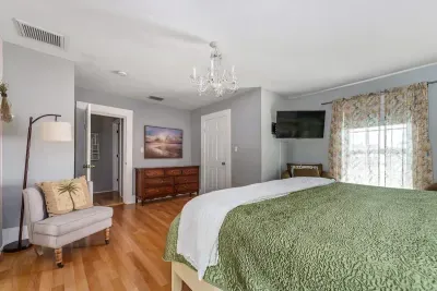 Bedroom 2 (upstairs) has a brand new king sized Tempur-Pedic mattress and convenient seating. The living room is right off of it, making it a true master suite. It also has a vanity area and full bathroom.