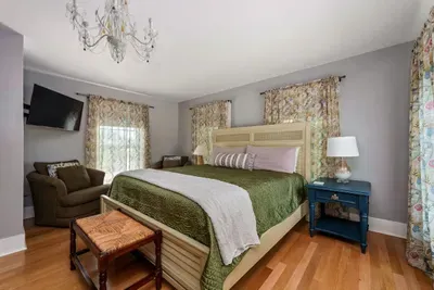 Bedroom 2 (upstairs) has a brand new king sized Tempur-Pedic mattress and convenient seating. The living room is right off of it, making it a true master suite. It also has a vanity area and full bathroom.