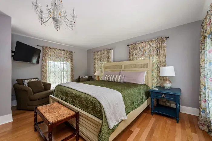 Bedroom 2 (upstairs) has a brand new king sized Tempur-Pedic mattress and convenient seating. The living room is right off of it, making it a true master suite. It also has a vanity area and full bathroom.