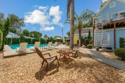 This outdoor space has ample seating for eating meals outside or simply laying & enjoying the sun.