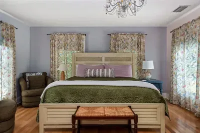 Bedroom 2 (upstairs) has a brand new king sized Tempur-Pedic mattress and convenient seating. The living room is right off of it, making it a true master suite. It also has a vanity area and full bathroom.