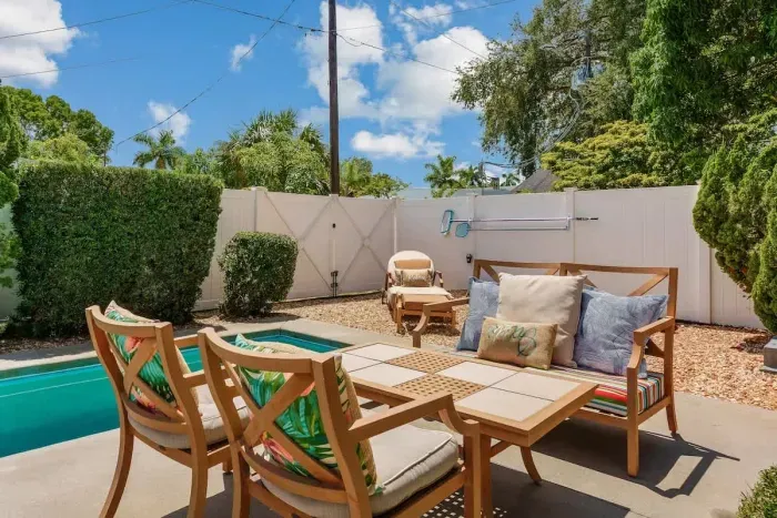 This outdoor space has ample seating for eating meals outside or simply laying & enjoying the sun.