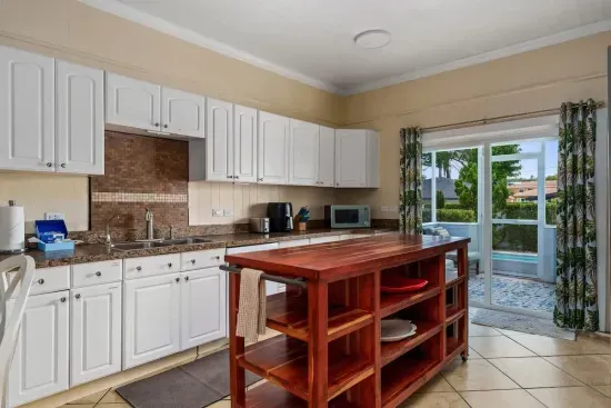 Plenty of cabinet space and room under the large island for all of your food and snacks.