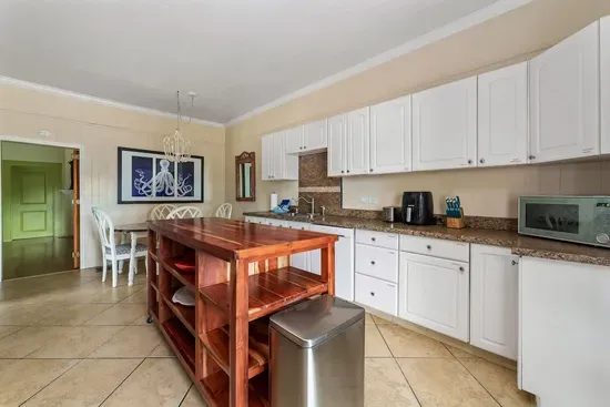 Your group will love this fully equipped kitchen, that leads to the screened-in lanai and the pool area.