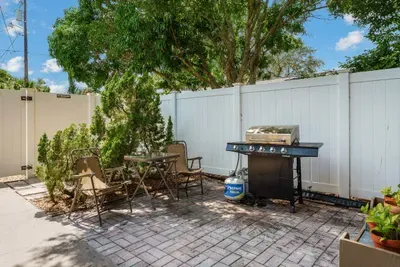 This outdoor space has ample seating for eating meals outside or simply laying & enjoying the sun.