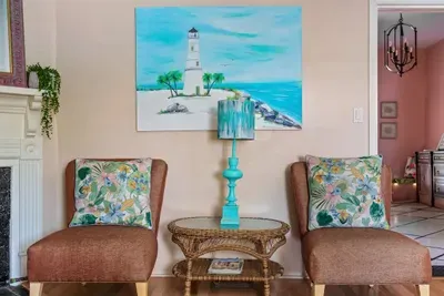 The living room is straight ahead as you walk through the foyer.