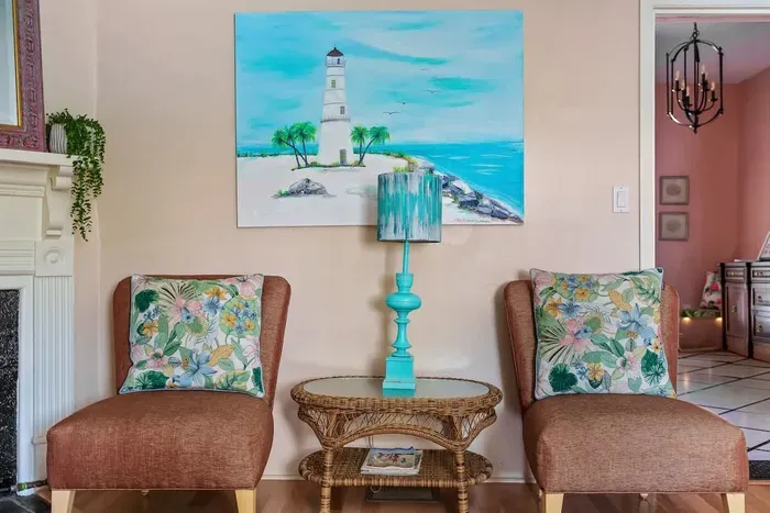 The living room is straight ahead as you walk through the foyer.