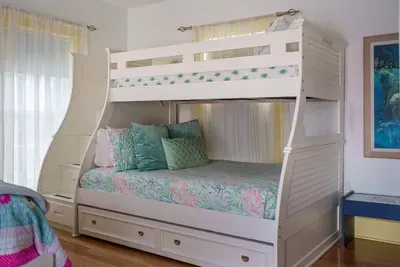 Bedroom 4 is the second bedroom upstairs and hosts the Crew's Quarters, which is a wonderful option for the kids. It has a queen bed, a twin over full bunk plus a twin trundle.