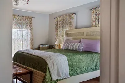 Bedroom 2 (upstairs) has a brand new king sized Tempur-Pedic mattress and convenient seating. The living room is right off of it, making it a true master suite. It also has a vanity area and full bathroom.