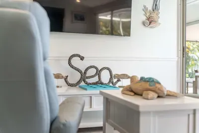 Relax and unwind in this bright, open living space, designed for comfort and style. Whether you’re lounging on the couch or enjoying good company, this cozy area is perfect for any occasion.