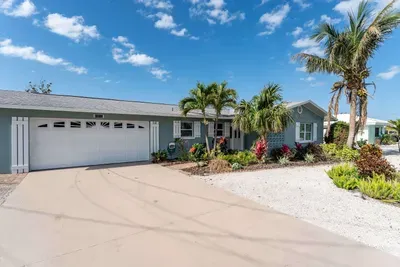 Welcome to your home base with plenty of room to park, play, and relax! This property features a private garage for your convenience and a wide-open view of the lush lawn and beautifully maintained exterior.