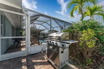 Relax by the sparkling pool and fire up the BBQ grill for a perfect outdoor dining experience. Whether it’s a casual cookout or a sunset meal, this area is designed for ultimate enjoyment.