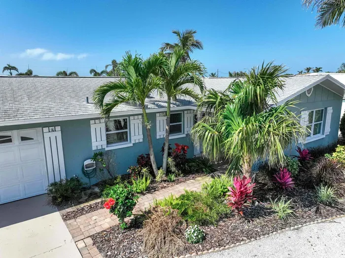 Step into vacation mode with this beautifully maintained front entrance, offering peaceful vibes and welcoming charm from the very start.