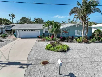 The moment you arrive, you’ll be greeted by a beautifully designed entrance that sets the tone for your stay. With its charming façade, lush landscaping, and welcoming front door, this home offers a warm and inviting first impression.