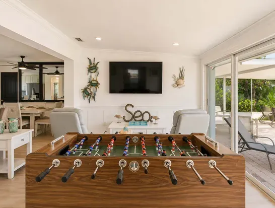 Kick back and kick goals! This cozy living space features a full-size foosball table for friendly matches, plus a wide-screen TV perfect for movie nights, game days, or binge sessions.