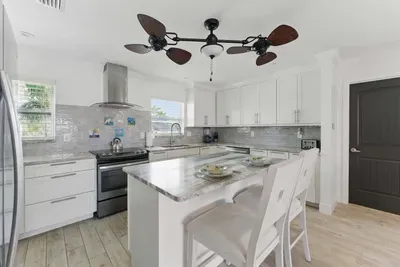 Cook with ease in this modern kitchen, complete with spacious counters, a full-size fridge, stove, microwave, coffee maker, and all the essentials to feel right at home.