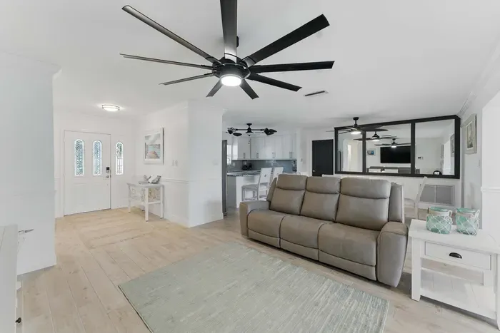 Relax in the roomy, inviting living area featuring a comfortable, wide couch perfect for lounging after a day of adventure.