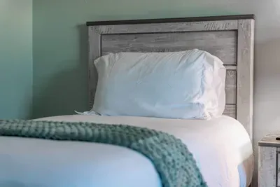 Perfect for solo travelers, this cozy single-sized bed offers a restful space to unwind after a busy day of exploring. Simple, comfortable, and designed with your relaxation in mind.