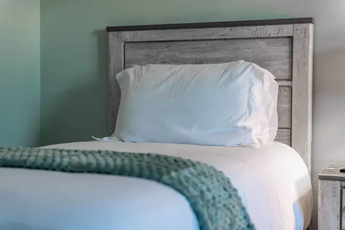 Perfect for solo travelers, this cozy single-sized bed offers a restful space to unwind after a busy day of exploring. Simple, comfortable, and designed with your relaxation in mind.