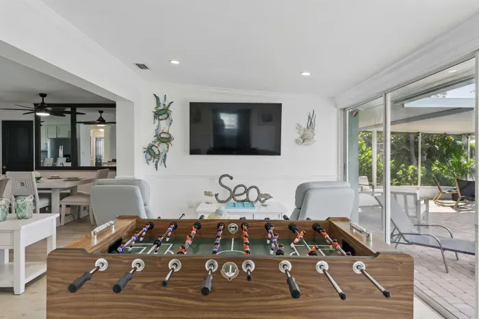 Kick back and kick goals! This cozy living space features a full-size foosball table for friendly matches, plus a wide-screen TV perfect for movie nights, game days, or binge sessions.