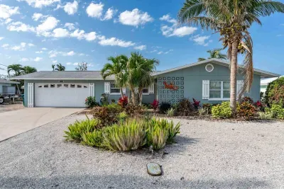 Welcome to your home away from home! The front exterior of this charming property is sure to make an impression, with its inviting entryway and lush landscaping.