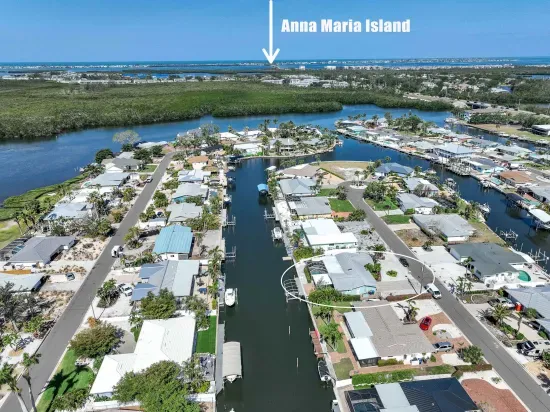 This stunning aerial view says it all — your vacation home is nestled on a peaceful canal just minutes from the world-famous Anna Maria Island! Enjoy quick access to white-sand beaches, vibrant local dining, and unforgettable sunsets.