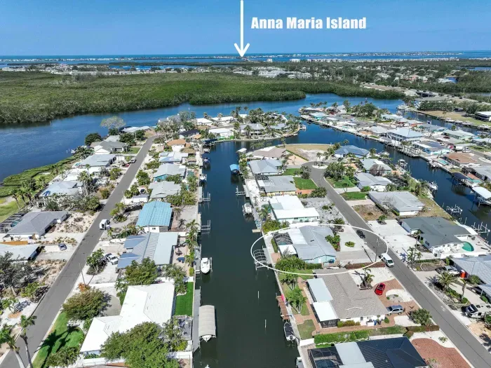 This stunning aerial view says it all — your vacation home is nestled on a peaceful canal just minutes from the world-famous Anna Maria Island! Enjoy quick access to white-sand beaches, vibrant local dining, and unforgettable sunsets.