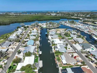 Get a full view of your waterfront escape this top-down canal shot captures the peaceful flow and picture-perfect setting of your stay.