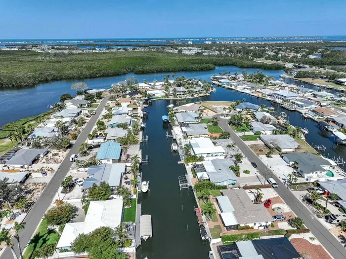 Get a full view of your waterfront escape this top-down canal shot captures the peaceful flow and picture-perfect setting of your stay.