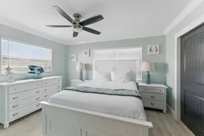 Rest easy on a plush queen-size bed, perfectly paired with a sleek, spacious side drawer for all your bedside essentials. Whether you're settling in for the night or staying organized during your stay.