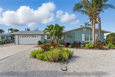 Step into vacation mode with this beautifully maintained front entrance, offering peaceful vibes and welcoming charm from the very start.