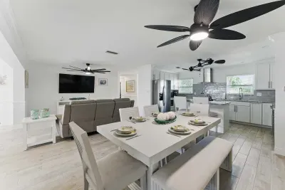 Gather around the elegant dining table perfect for meals, laughter, and lasting memories in a warm, inviting space.