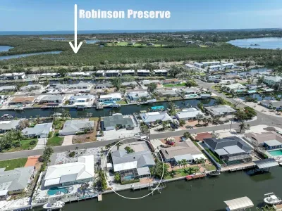 Take in the breathtaking view from above! This top-down perspective gives you a full overview of the property, capturing the beauty of the landscape and outdoor spaces in one stunning shot.