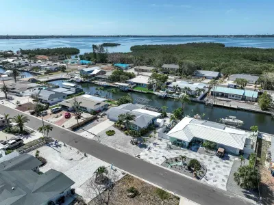 Take in the stunning bird’s-eye view of the peaceful canal where calm waters meet natural beauty in one unforgettable scene.