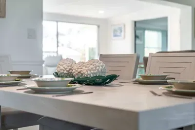 Enjoy meals in style at this elegant dining table, perfect for family gatherings or intimate meals. The spacious dining area creates a warm and inviting atmosphere for every occasion.