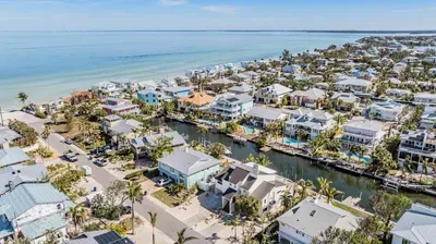 Prime coastal location just steps from the ocean, with canal access for boating and water adventures. Surrounded by luxury homes and turquoise waters, this peaceful neighborhood offers the ultimate Florida Keys getaway vibe.