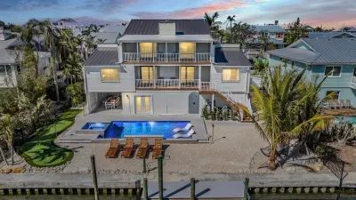 Stunning waterfront home with private pool, spacious patio, and multiple balconies. Enjoy sunset views, outdoor dining, and direct water access. A perfect coastal escape blending luxury, comfort, and unforgettable scenery.