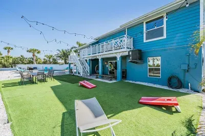 Play cornhole on the turf, dine under string lights, or lounge in the sun. With plenty of space for games and gatherings, this outdoor retreat is perfect for entertaining and making lasting memories.