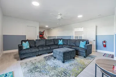 Featuring a huge sectional sofa, vibrant décor, and plenty of room to relax or play. Ideal for family nights, kids’ entertainment, or unwinding after a day of waterfront adventures.