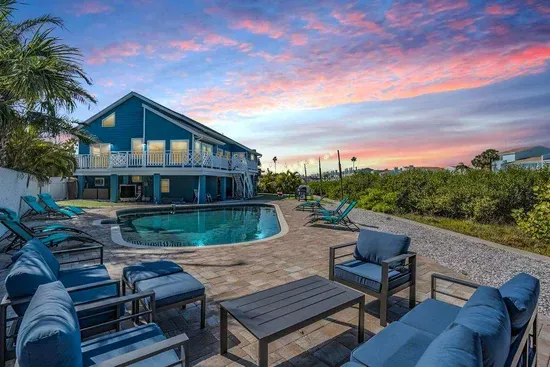 Coastal paradise awaits! Stunning beachside retreat featuring a sparkling pool, spacious outdoor lounge, and breathtaking sunset views. Perfect blend of luxury & relaxation your dream getaway starts here!