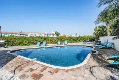 Dive into relaxation! This sparkling private pool is surrounded by palm trees, lounge chairs, and plenty of space to soak up the sun. Ideal for refreshing swims, family fun, or unwinding with a drink in hand.