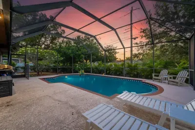 Enjoy a sparkling private pool, spacious deck for lounging, and tranquil tropical views under glowing evening skies. Ideal for morning swims, relaxing afternoons, and unforgettable nights with family and friends.