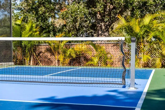 Your own private pickleball court awaits! Enjoy a professionally lined playing surface, net in place, and lush tropical landscaping for added privacy.