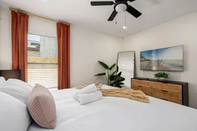 Unwind in this bright and inviting bedroom featuring a plush king bed, calming coastal décor, and stylish modern furnishings. Soft natural light and thoughtful design create the perfect relaxing retreat for peaceful nights and restful mornings.
