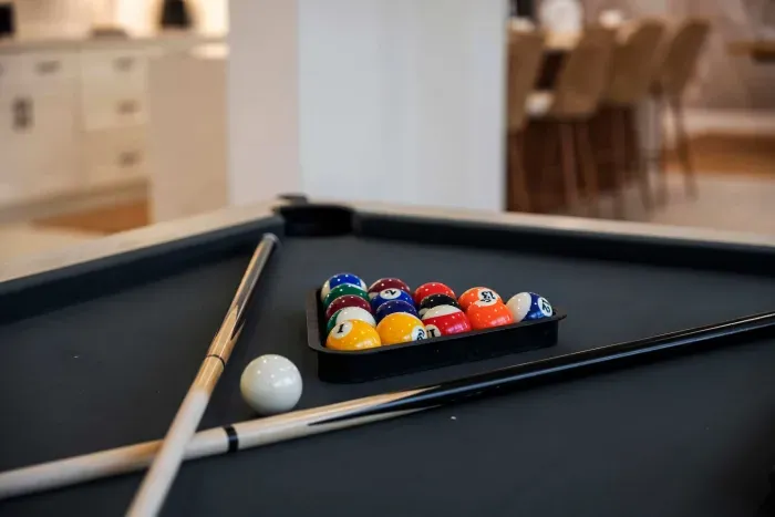 Rack up some fun in this stylish game room featuring a sleek pool table and plenty of space to unwind. Perfect for friendly competition, evening entertainment, or relaxing with family and friends after a day in the sun.